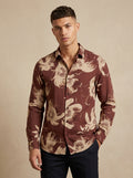 Snipes printed shirt featuring a colorful graphic design, long sleeves, and classic collar on a lightweight fabric.