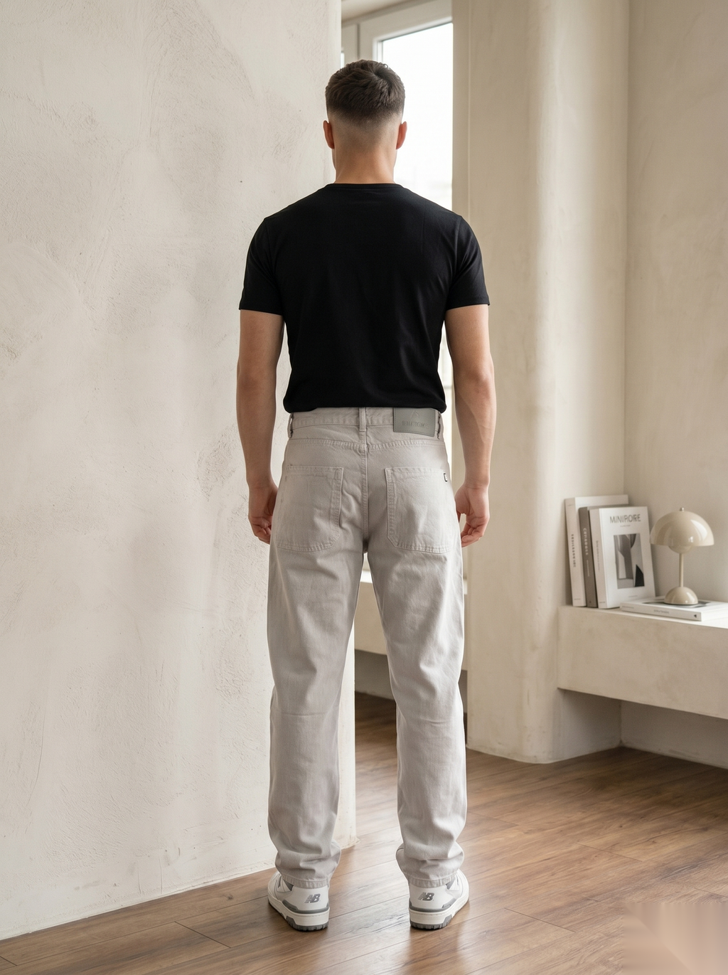 Snipes baggy fit denim jeans with relaxed style and classic blue wash, displayed on a hanger.
