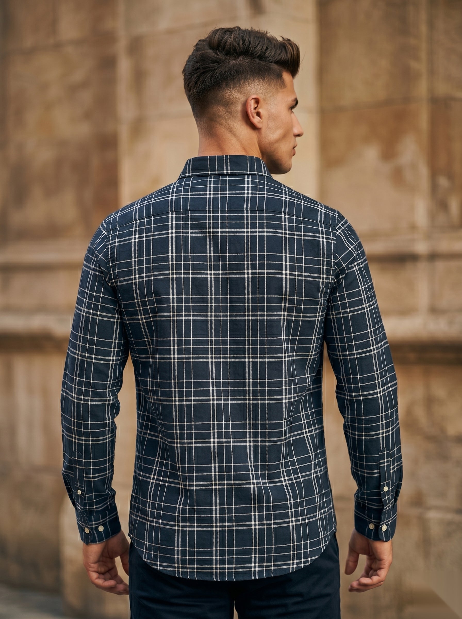Snipes checked shirt with a classic plaid pattern, featuring button-down front and collar, displayed on a hanger.