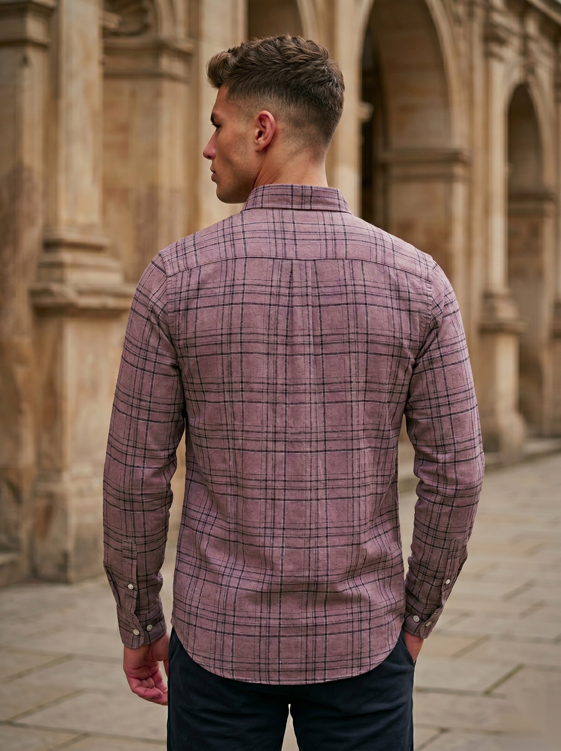 Snipes checked shirt with a classic pattern, featuring a button-up front and collar, displayed on a hanger.