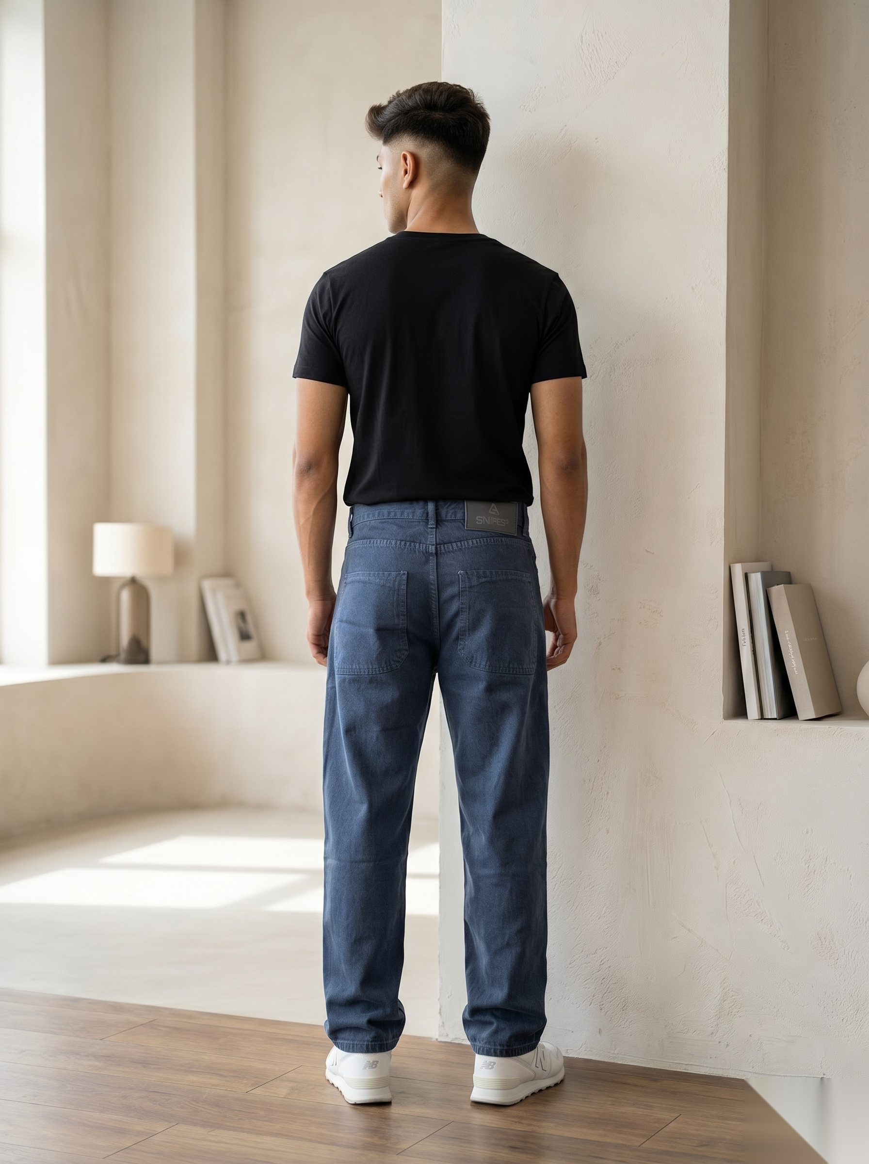 Snipes baggy fit denim jeans shown on a model, featuring relaxed, loose fit style and classic denim fabric.