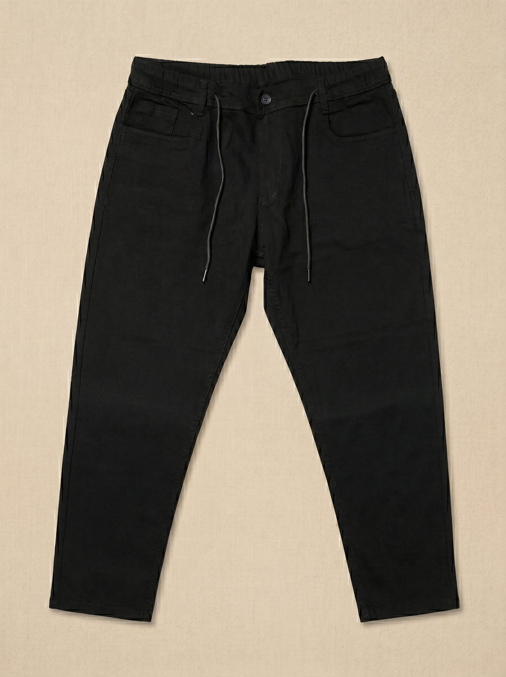Snipes carrot fit denim jeans displayed on a hanger, showcasing the stylish, tapered fit and classic blue denim fabric.
