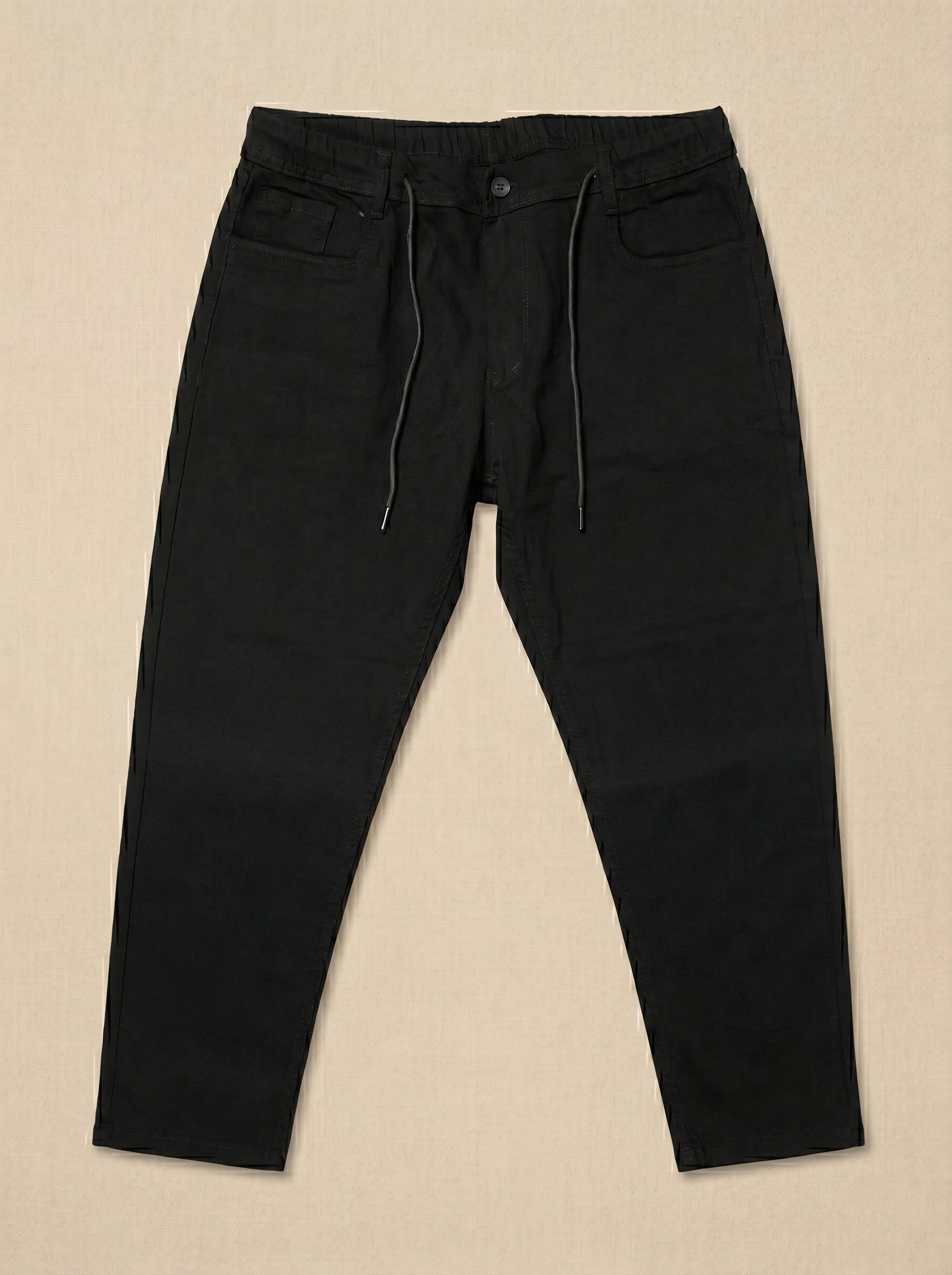 Snipes carrot fit denim jeans displayed on a hanger, showcasing the stylish, tapered fit and classic blue denim fabric.
