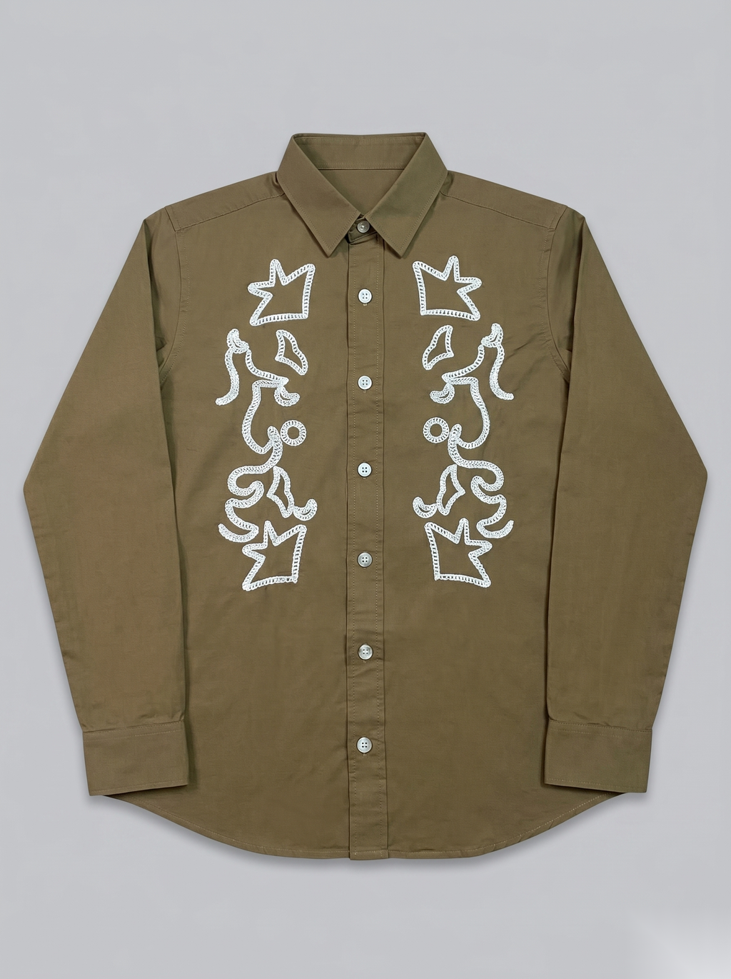 Snipes embroidery full-sleeve shirt with intricate stitching and detailed design, displayed on a hanger.