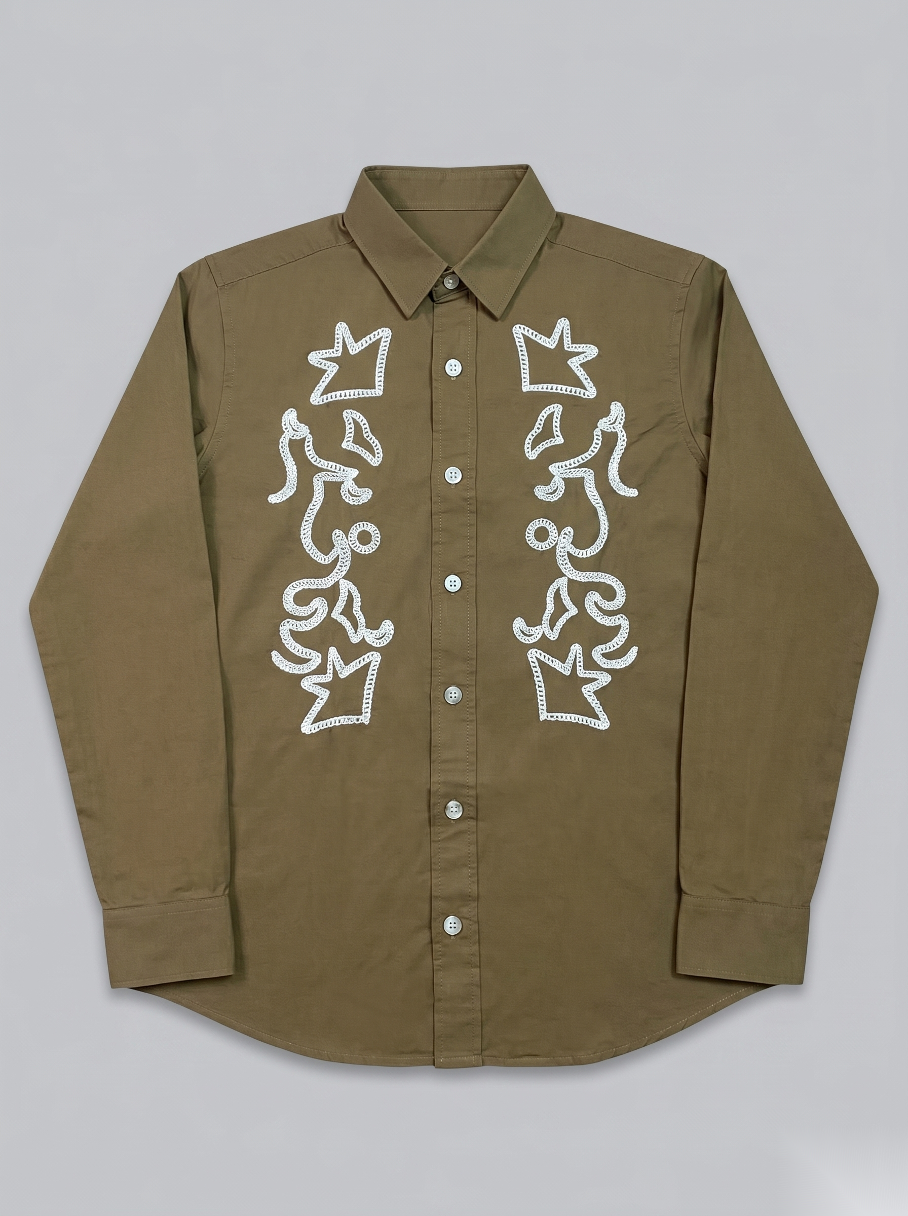 Snipes embroidery full-sleeve shirt with intricate stitching and detailed design, displayed on a hanger.