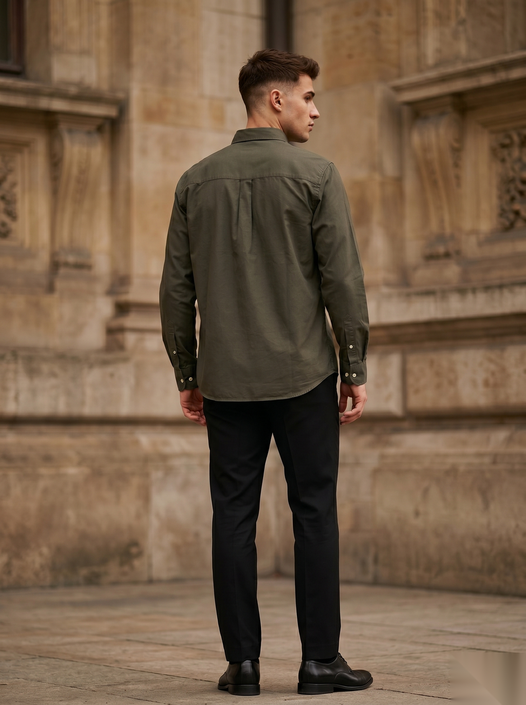 Snipes embroidery full-sleeve shirt featuring detailed stitched patterns and a classic collar, displayed on a hanger.