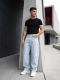 Snipes Barrel Fit denim jeans showing the relaxed, tapered leg design in classic blue wash with visible stitching and pockets.