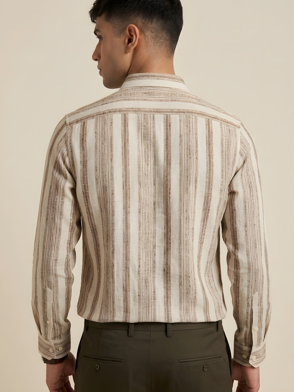 Beige striped shirt by Snipes with a classic collar and button-down front, displayed flat on a plain background.