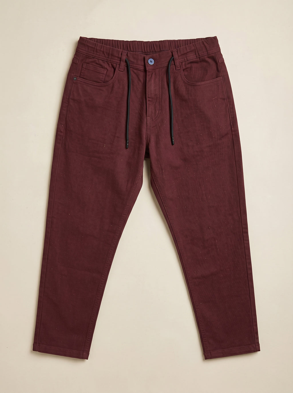 Snipes carrot fit denim jeans shown in dark blue with classic five-pocket design and slim tapered leg.
