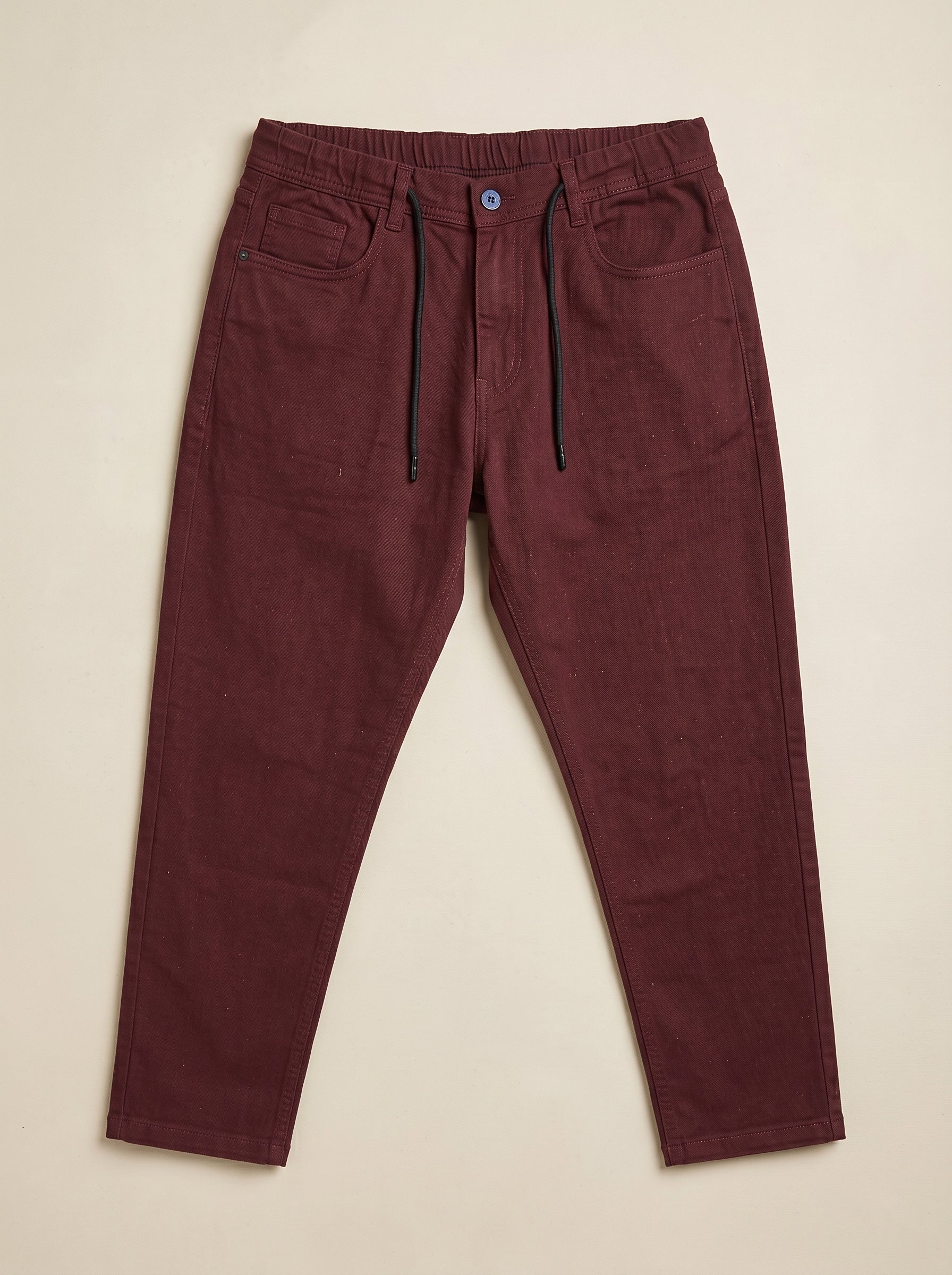 Snipes carrot fit denim jeans shown in dark blue with classic five-pocket design and slim tapered leg.