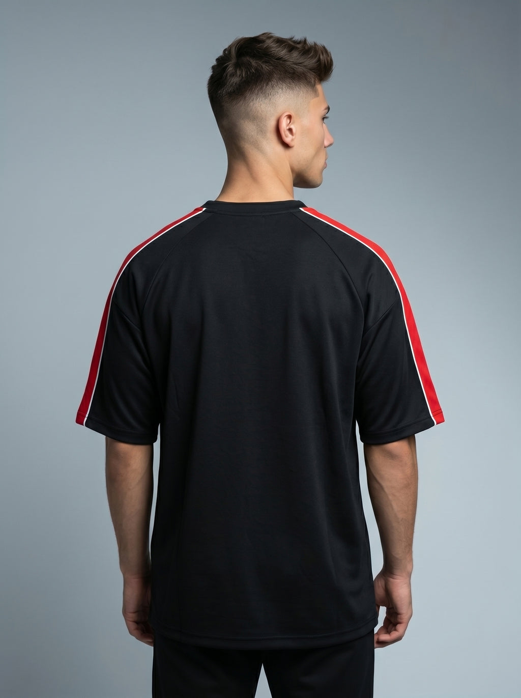 Snipes FB Oversized T-Shirt in black, featuring a relaxed fit, crew neckline, and short sleeves, displayed on a hanger.