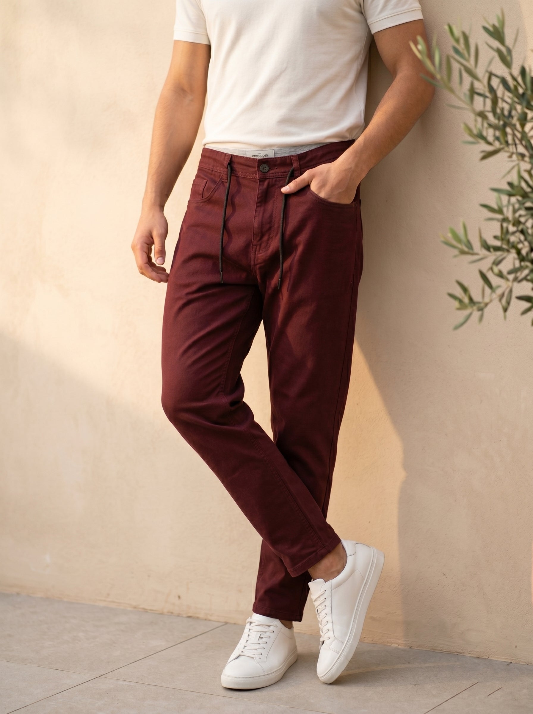 Snipes carrot fit denim jeans displayed on a model, showcasing the stylish cut and classic blue wash.