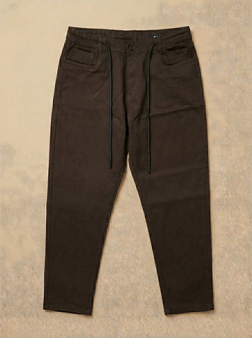 Snipes carrot fit denim jeans displayed on a model, showcasing stylish casual denim with a tapered fit.