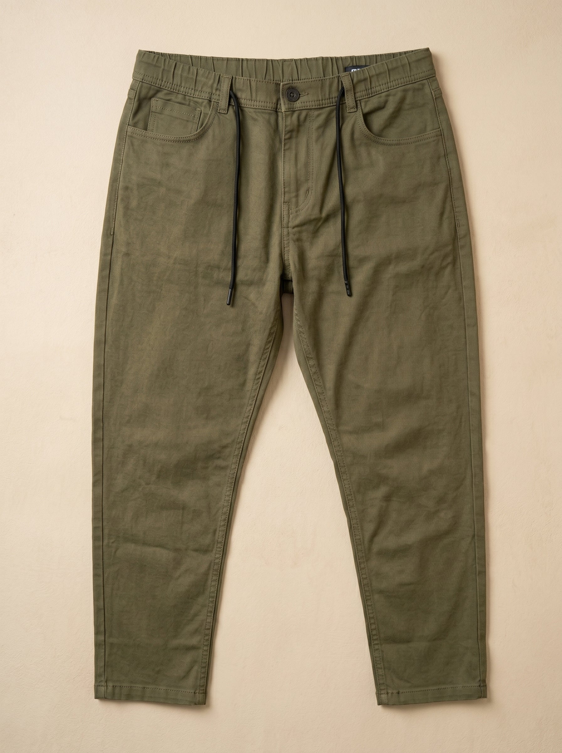 Snipes carrot fit denim jeans showing slim, tapered design in classic blue denim fabric.