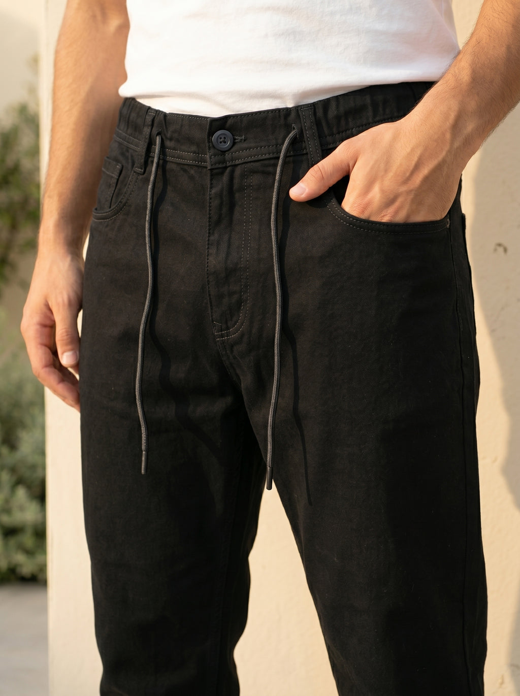 Snipes carrot fit denim jeans displayed on a model, showcasing slim fit cut and classic denim wash.