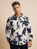 Snipes printed shirt featuring colorful, abstract design, casual fit, with visible collar and long sleeves.