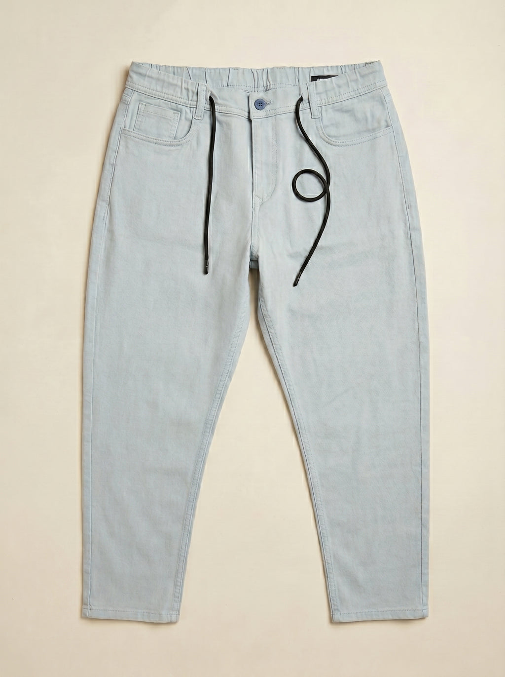 Snipes carrot fit denim jeans showing front view, with classic five-pocket design and medium blue wash.