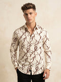 Printed Snipes shirt with colorful design, long sleeves, and button-up front displayed on a hanger.