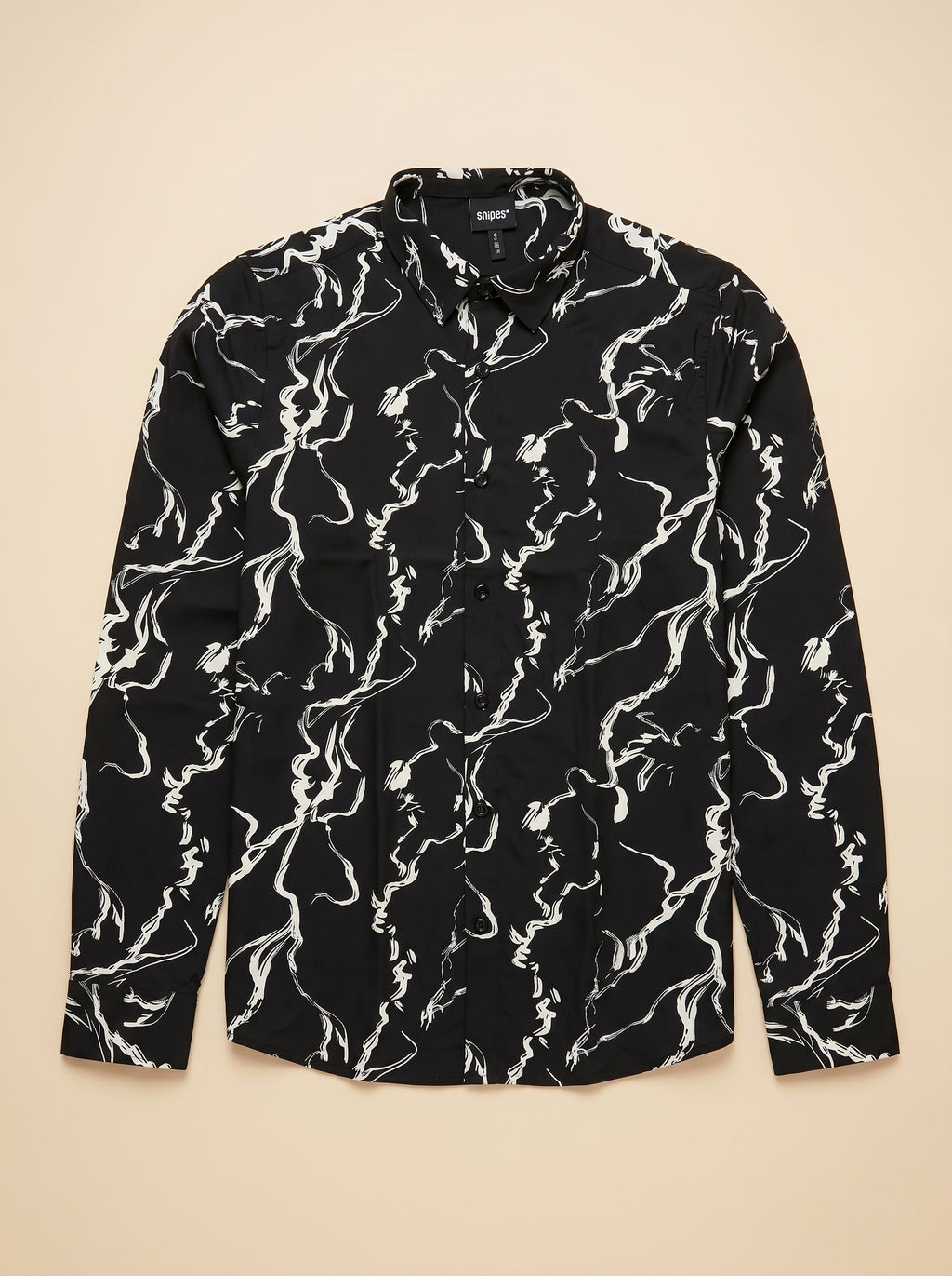 Snipes printed shirt with colorful graphic design, long sleeves, and classic collar on model showing front view.