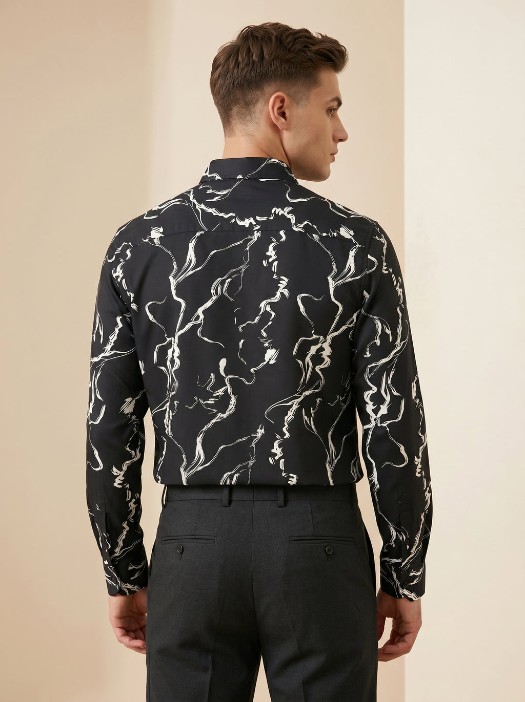 Snipes printed shirt featuring vibrant patterns and casual fit, displayed on a hanger against a plain background.