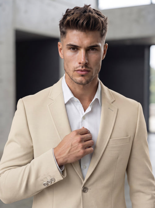 Beige Snipes blazer with tailored fit, lapel collar, and button closure, shown on a hanger against a plain background.