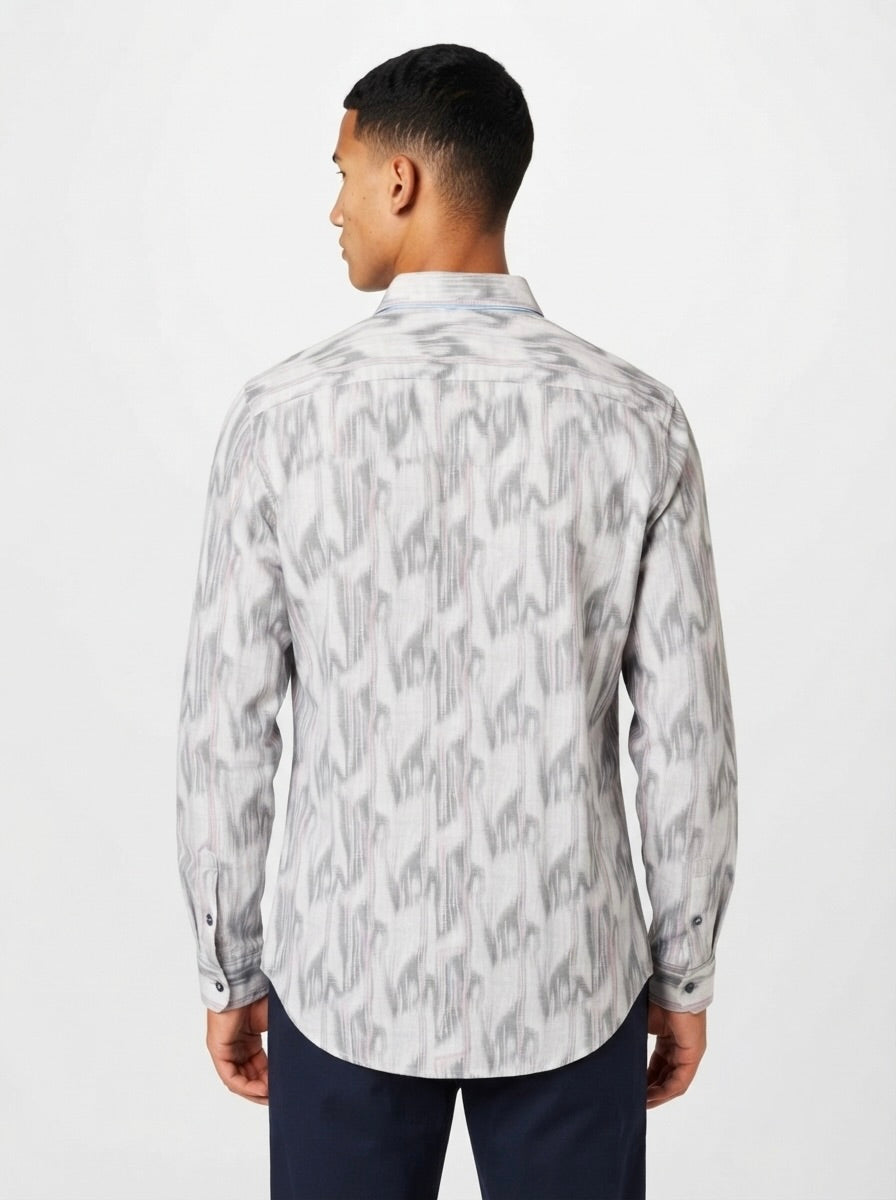 Men’s abstract print full sleeve casual shirt by Snipes, featuring a vibrant, artistic pattern on soft fabric.
