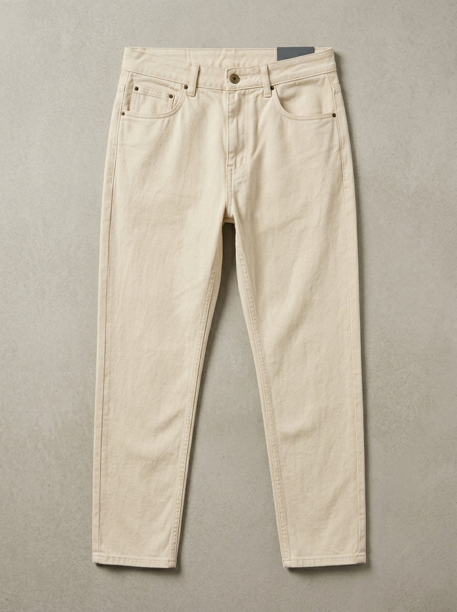 Snipes mom fit denim jeans displayed on a hanger, showcasing classic blue color and relaxed fit style.