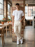 Snipes MOM Fit jeans displayed on a hanger, showcasing classic denim with a relaxed, high-waisted style for women.