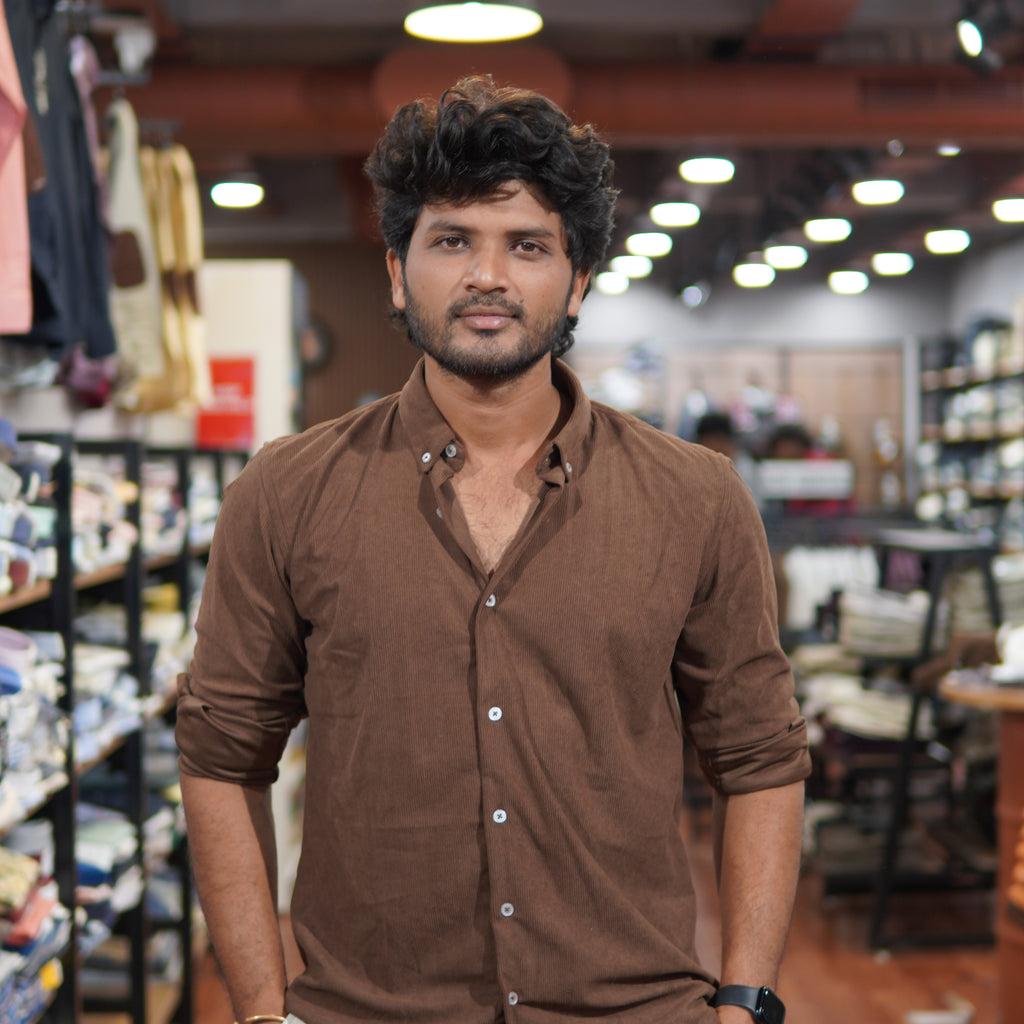 Premium Snipes corduroy shirt in rich color, showcasing texture and button-up design on a wooden surface.