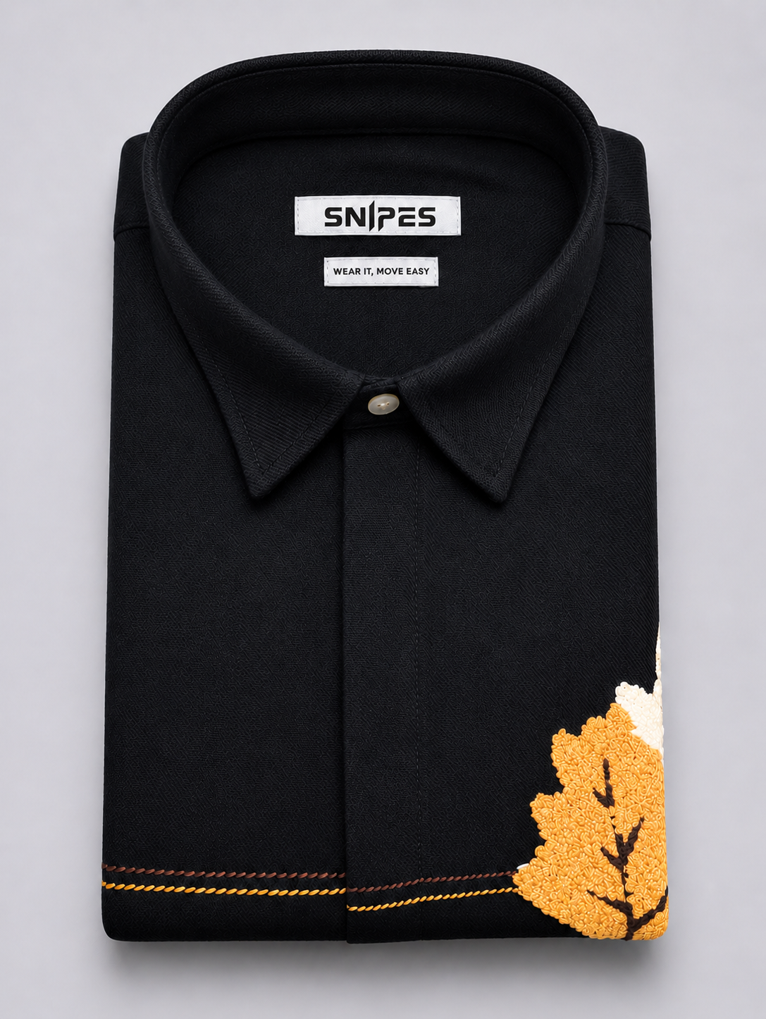 Folded black Snipes men’s boxy fit embroidered shirt with visible SNIPES label