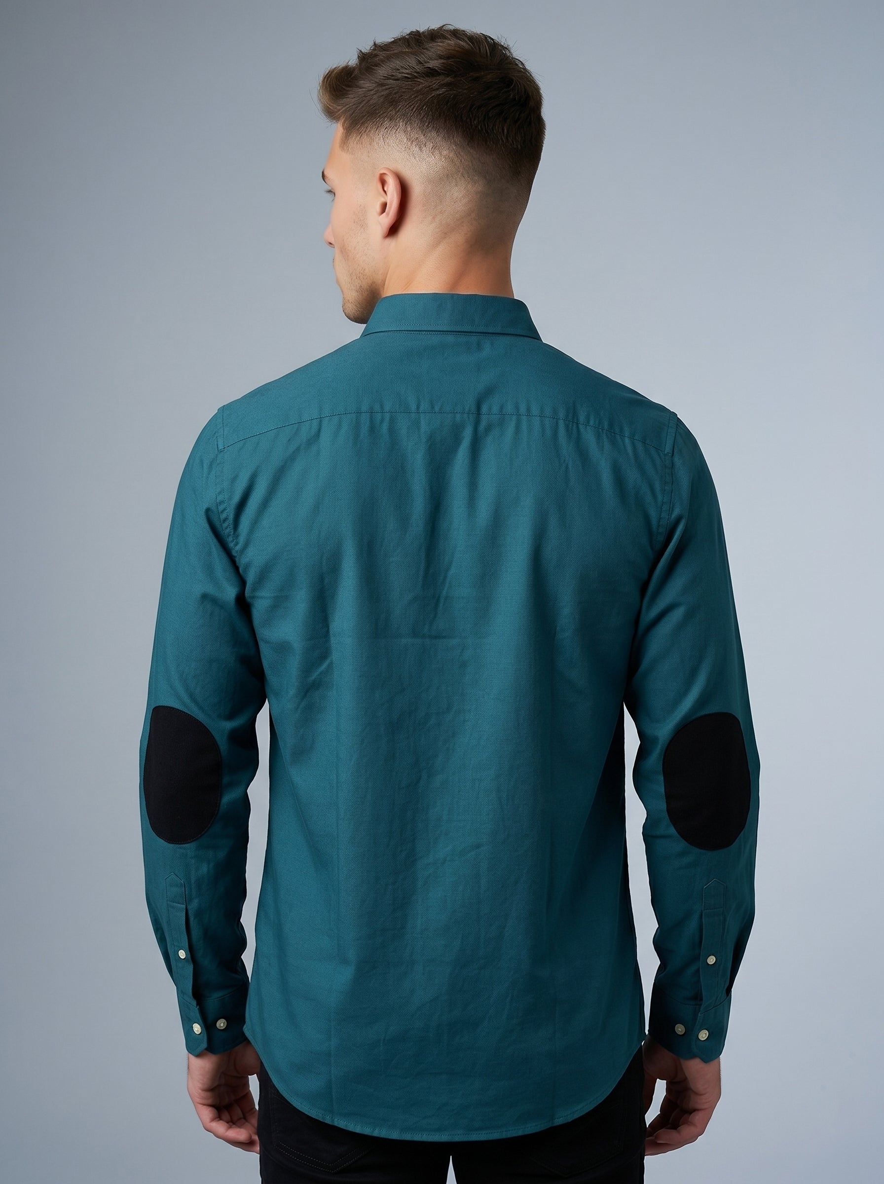 Snipes elbow patch shirt featuring a classic button-up design with contrasting patches on the elbows, displayed on a model.