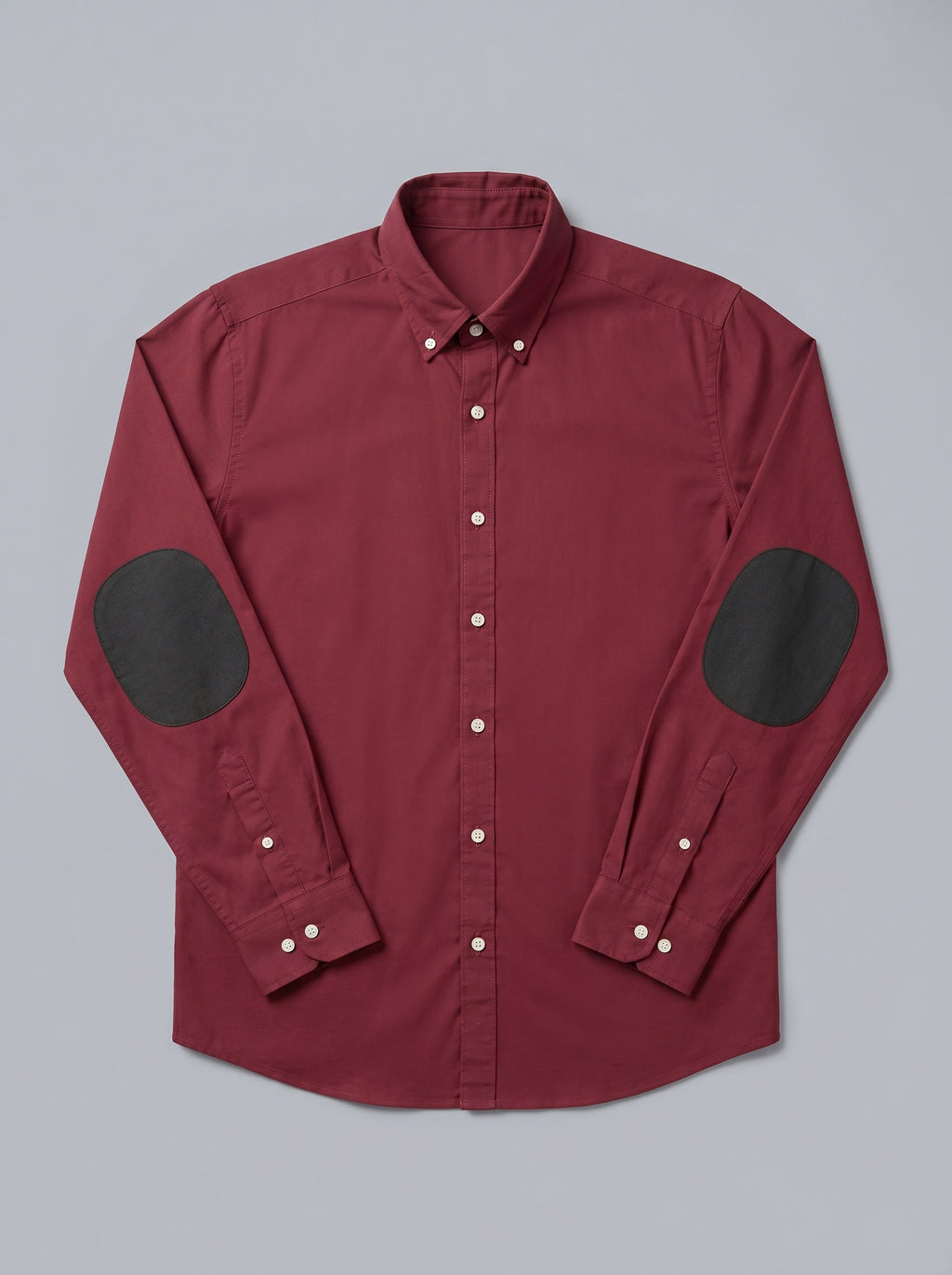 Snipes elbow patch shirt featuring a classic design with contrasting patches on the elbows, displayed on a neutral background.