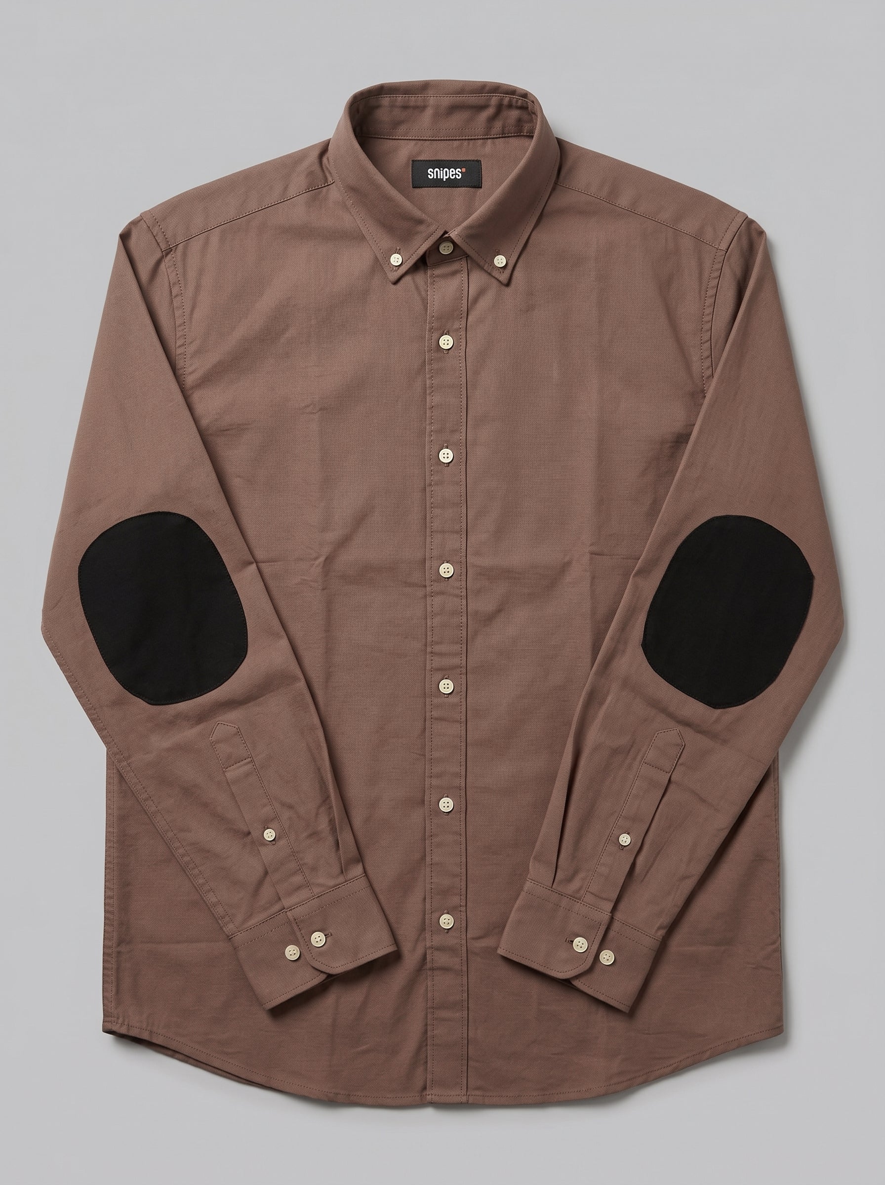 Snipes men's elbow patch shirt featuring a casual design with contrasting elbow patches and a button-down collar.