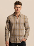 Snipes checked shirt with red, black, and white pattern, casual button-up design, displayed on a hanger.